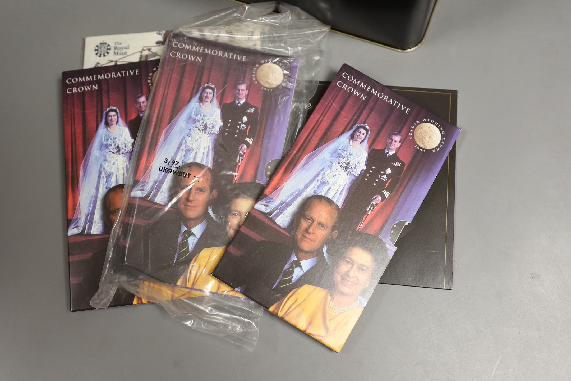 A collection of UK Royal mint brilliant uncirculated commemorative coins in presentation packs